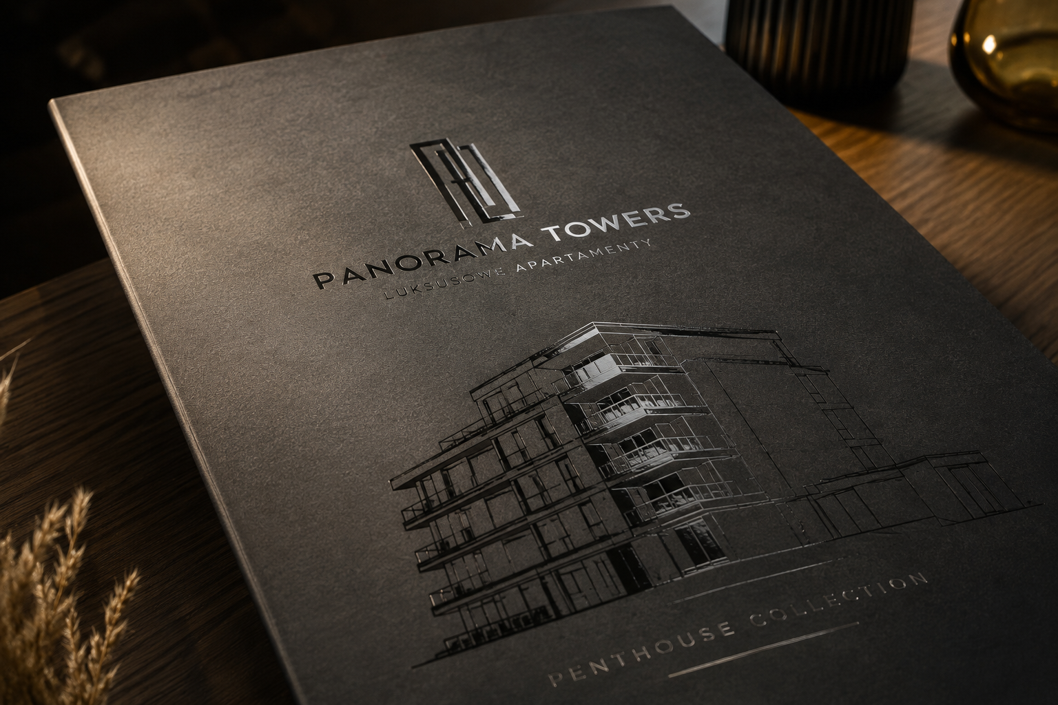 Błyszczący lakier wybiórczy UV na logo i wizualizacji architektonicznej na matowej teczce deweloperskiej.